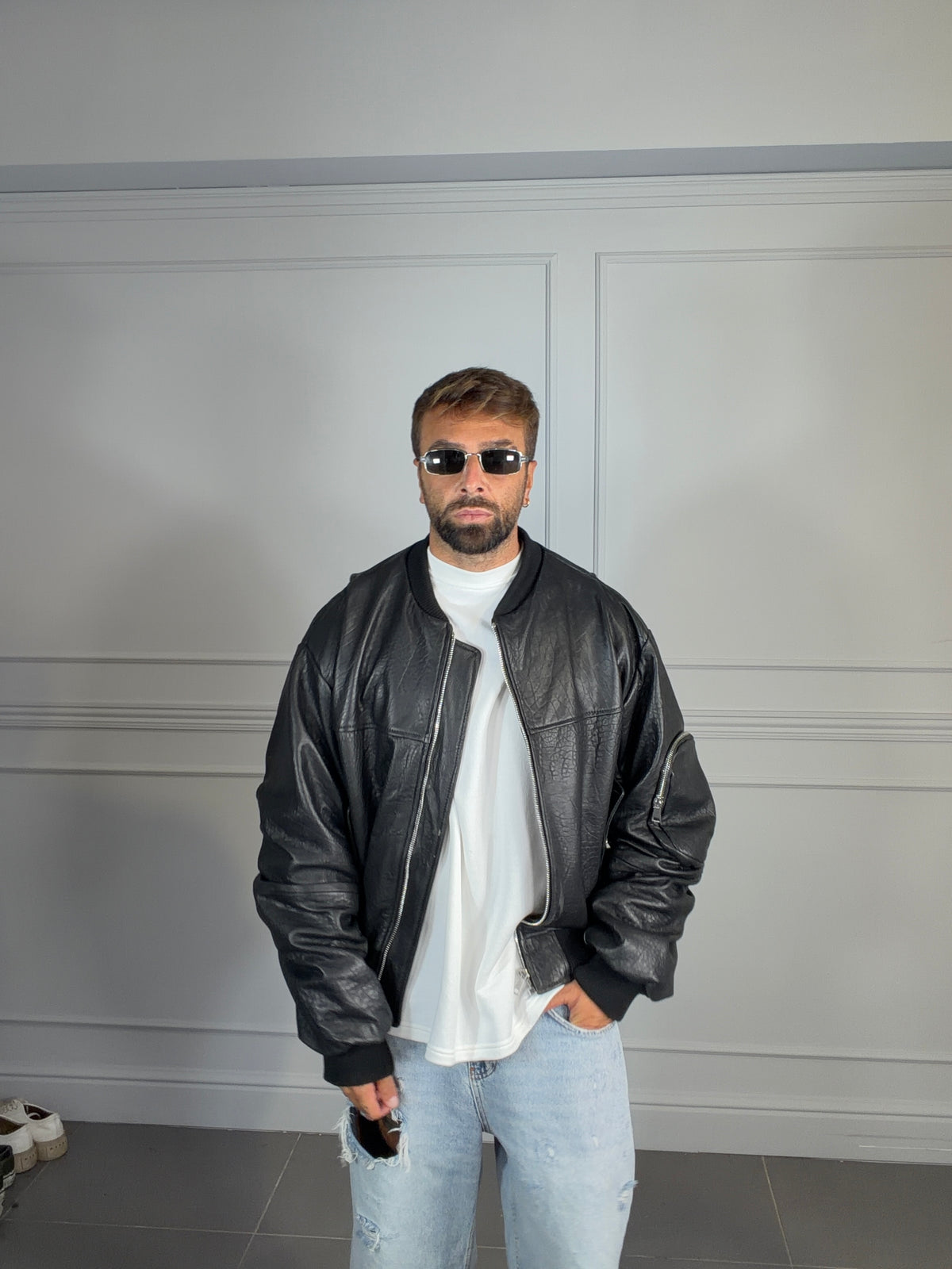 COLLEGE OVERSIZE CON MANICA ARRICCIO NERO MARTELLATO
